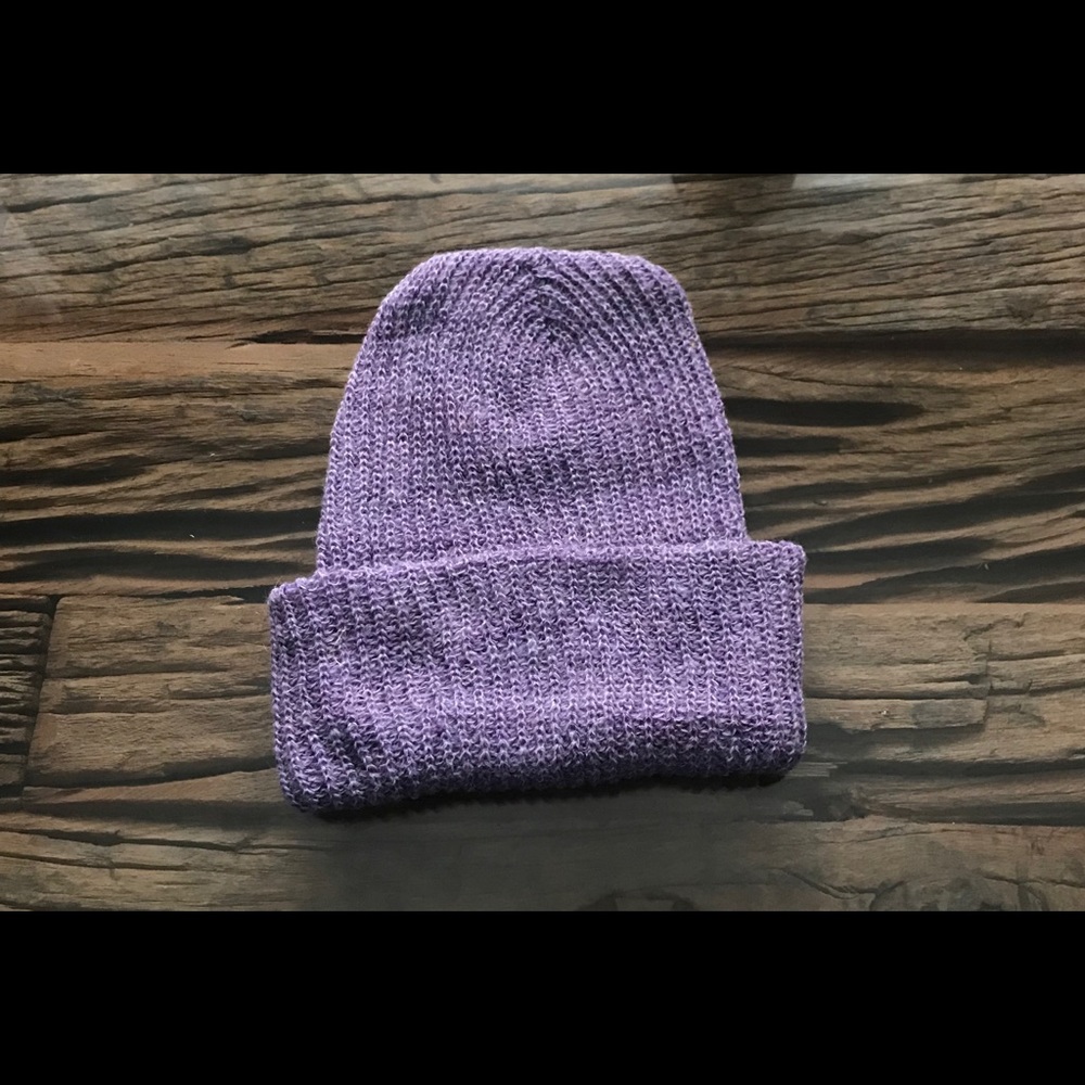 Winter hat. Light purple color. Knitted hat.